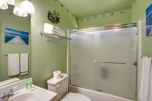 a bathroom with a shower and a toilet and a sink at 10 Mi to Lake Tahoe Beaches Home with Pool Table in South Lake Tahoe
