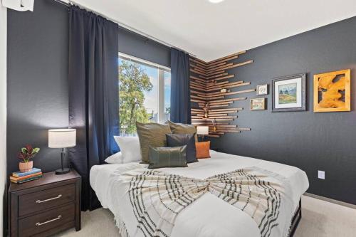 a bedroom with a large bed and a window at Brand New 3BD 2 5BTH Triplex Unit Near Downtown in Spokane