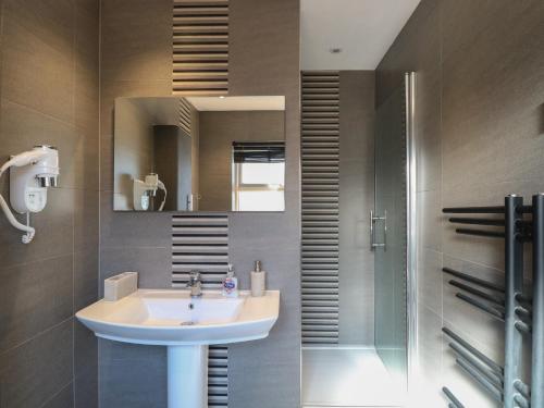 a bathroom with a sink and a mirror at Beach Haven in Norwich