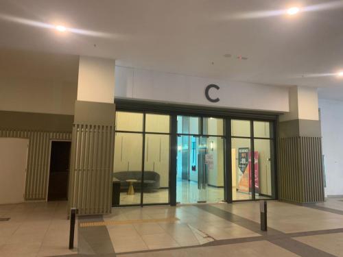 a lobby of a building with a c on the wall at Greenfield Residence, Bandar Sunway by The Comfort Zone in Petaling Jaya