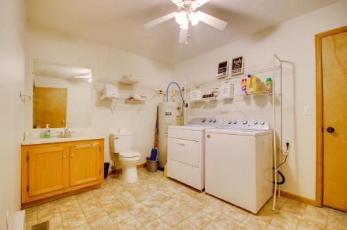 a bathroom with a washer and a toilet and a sink at 5 Mi to Dtwn Waynesville 4-Acre Group Getaway! in Waynesville