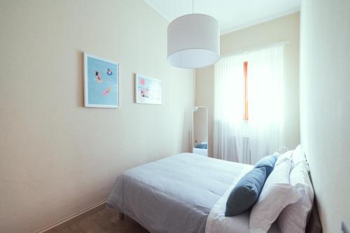 Ένα ή περισσότερα κρεβάτια σε δωμάτιο στο Celeste Simple Apartment