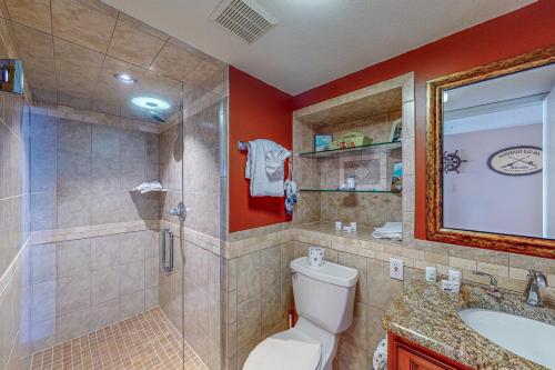 a bathroom with a shower and a toilet and a sink at Sand and Sea Enjoyment Retreat in Ormond Beach