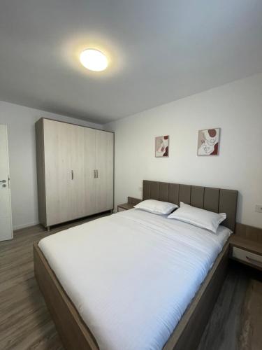 Кровать или кровати в номере Comfort & Luxury Apartaments PNMresidence