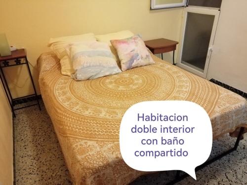 a bed in a room with a dialog box with a picture of a bed at lo flamenc @Amposta in Amposta