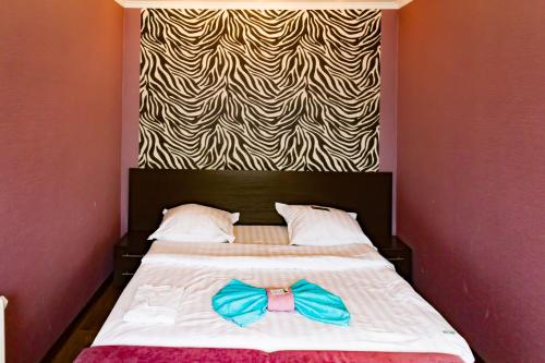 Ένα ή περισσότερα κρεβάτια σε δωμάτιο στο Петербург