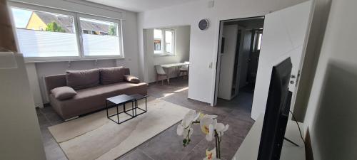 a living room with a couch and a table at Quiet House - 10 min away from Cologne in Bergisch Gladbach