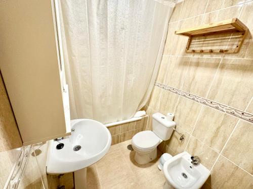 a small bathroom with a sink and a toilet at Sunny Beach Villa - El Medano in El Médano