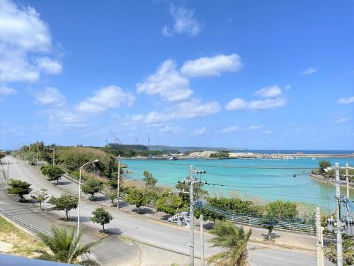a view of a body of water from a balcony at Hotel Miyakojima in Miyako Island