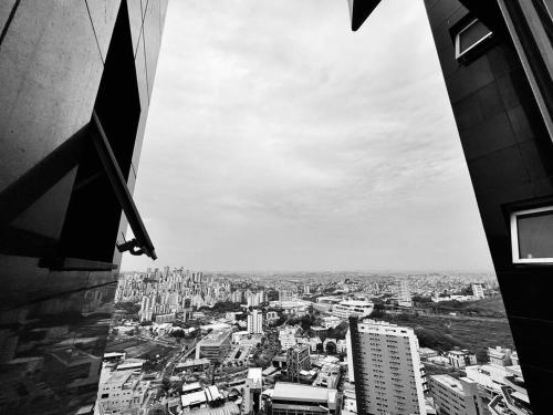 a view of a city from a building at Renoir - Av Barão Homem de Melo nº 4520 - pegar nº do flat no chat após reserva in Belo Horizonte