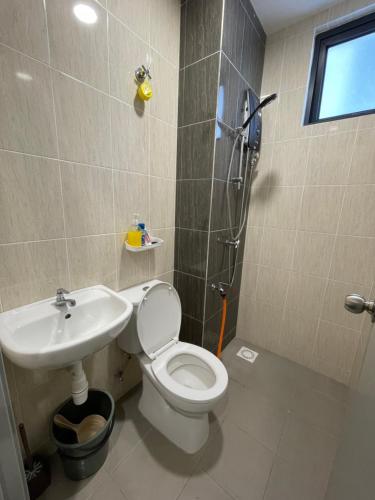 a bathroom with a shower and a toilet and a sink at H&Z HOMESTAY @ VISTA BANGI in Kajang