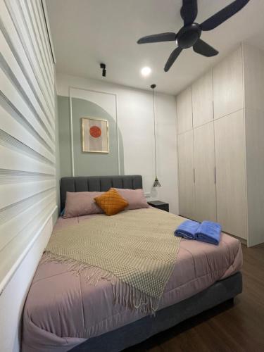 a bedroom with a bed with a ceiling fan at H&Z HOMESTAY @ VISTA BANGI in Kajang