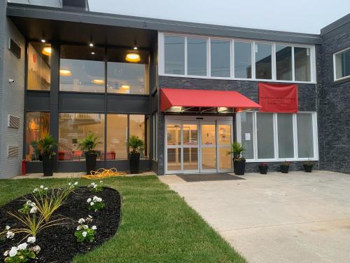 a building with a red awning in front of it at Superior Shores Hotel BW Signature Collection in Thunder Bay