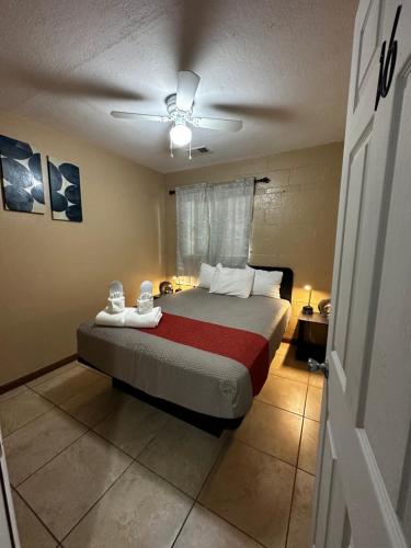 a bedroom with a bed and a ceiling fan at WILLIAMS AZ HOSTEL in Williams