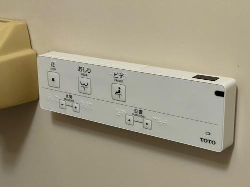 a white video game controller sitting on a table at Hotel Sejour Mint in Hakuba in Hakuba