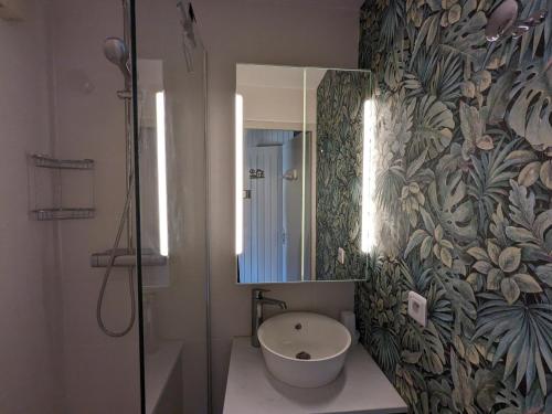 a bathroom with a sink and a mirror at Appartement La Clusaz, 3 pièces, 6 personnes - FR-1-459-211 in La Clusaz
