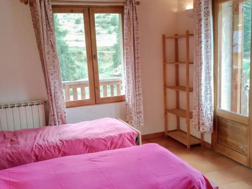 a bedroom with two beds and a window at Chalet Le Monêtier-les-Bains, 6 pièces, 17 personnes - FR-1-762-43 in Le Monêtier-les-Bains