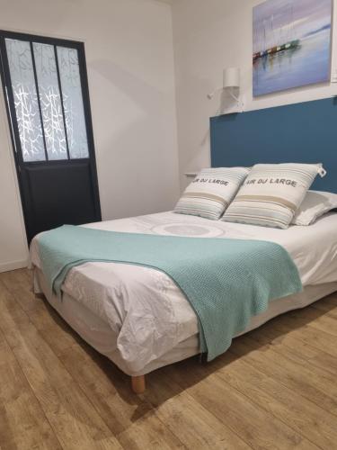 Ένα ή περισσότερα κρεβάτια σε δωμάτιο στο Appartement de charme citadelle Bastia
