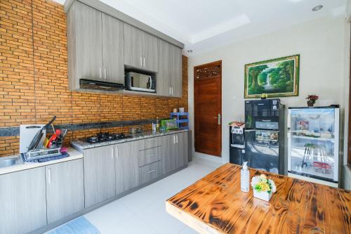 Kuchyň nebo kuchyňský kout v ubytování Wayan House Seminyak