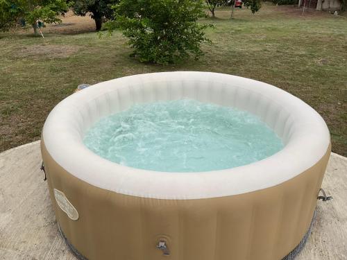 a large hot tub in a yard at Las Nubes Domo in La Mesa