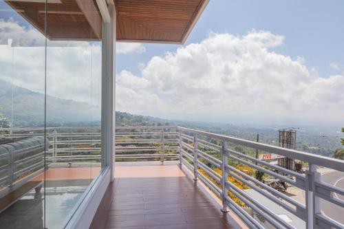 a view from the balcony of a house at Lavender - Taman Tanda in Bedugul