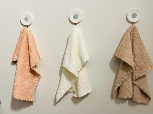 a group of towels hanging on a wall at Skyline Serenade in Johannesburg