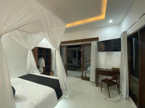 Ένα ή περισσότερα κρεβάτια σε δωμάτιο στο Namika Villas Ubud