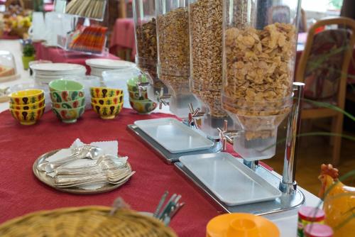 a table topped with plates and bowls of food at Hotel Bel-Air Eden in Grindelwald