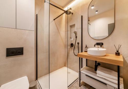 a bathroom with a sink and a shower at MAROEN 3 Lux Apartment Old Town in Split