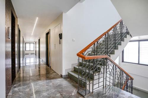 a hallway with a staircase in a house at FabHotel Ansh in Aurangabad