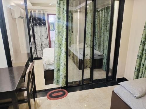 a living room with a table and a mirror at Avadh vihara Beds & Breakfast in Varanasi