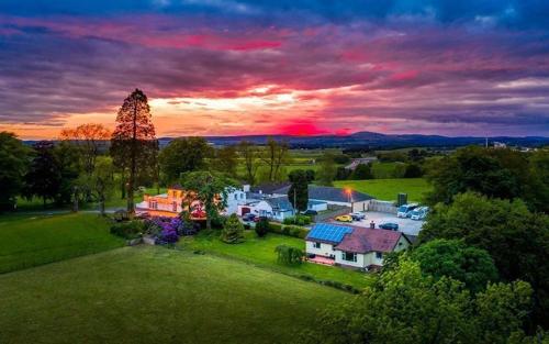 an aerial view of a house on a field at Dryfesdale Hotel - BW Signature Collection in Lockerbie