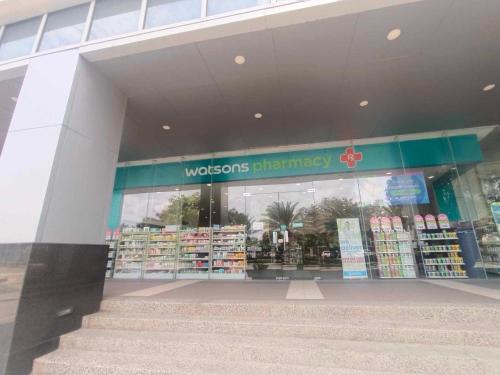 a store front of a woolworths pharmacy at Mactan Newtown 2 Bedroom near Mactan Airport in Punta Engaño