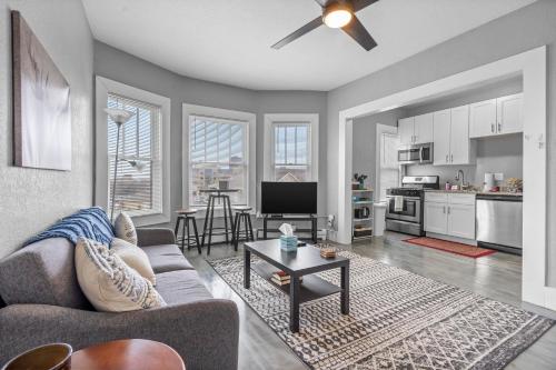 a living room with a couch and a table at Navarre Apartments in Des Moines