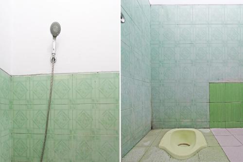 a bathroom with a shower and a toilet at SPOT ON 92373 Kristin Homestay 2 in Pati