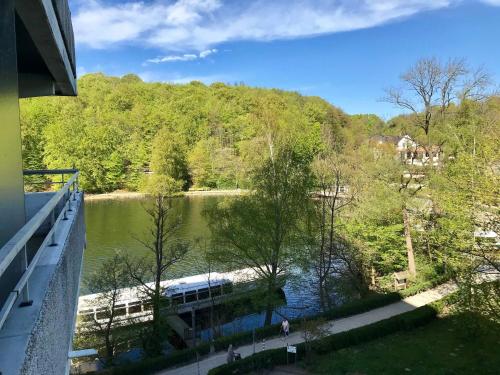 a view from a balcony of a river with a train at Appartement JZ in Malente