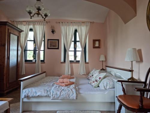 Postel nebo postele na pokoji v ubytování Taverna 1860 Rooms & Apartments