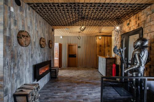 a lobby with a statue of a man on the wall at Ego Hotel Буковель in Yablunytsya