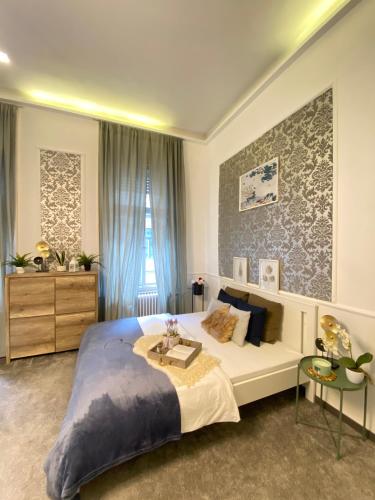 Llit o llits en una habitació de Sziv Apartment - Modern and Comfortable