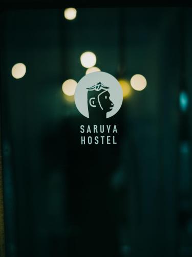 a sign that says sauva hospital with a horse at Hostel Saruya in Fujiyoshida