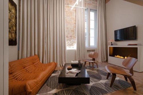 TV a/nebo společenská místnost v ubytování MiHotel Serlin