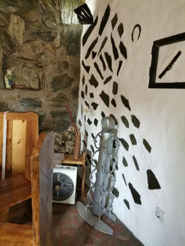 a room with a wall that has a painting on it at Apartmani Pinkum in Veliko Gradište