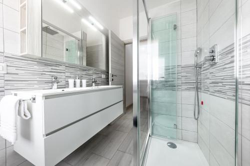 a bathroom with a sink and a shower at [House Near Train Station]A/C in Seriate