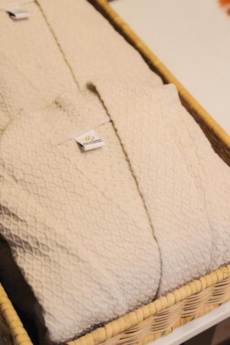 a mattress with a tag on top of it at CHINO@NIMMAN Luxury Boutique Hotel in Chiang Mai