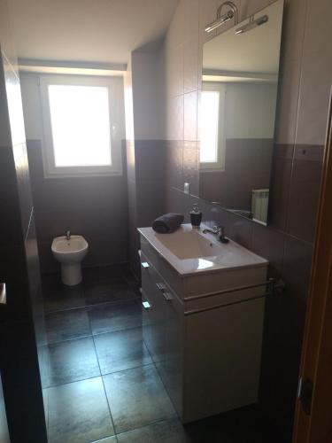 a bathroom with a sink and a toilet at VISTAVEGA Cella in Cella