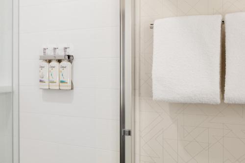 a bathroom with a shower stall with a towel at Holiday Inn Express Hotel & Suites Van Wert, an IHG Hotel in Van Wert