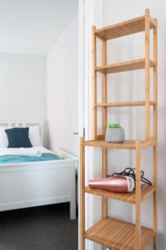 a bedroom with a bunk bed and a ladder at Belfast City - 3 Bed Cosy Terrace Home - Hip and Trendy Ormeau Road in Belfast