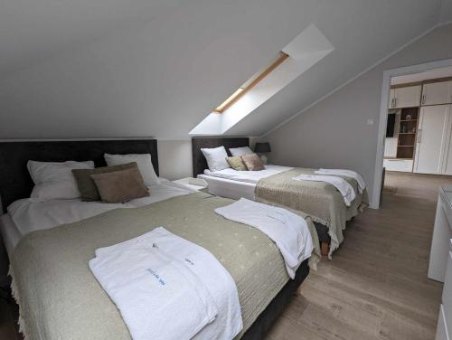 Postel nebo postele na pokoji v ubytování Apartamenty Na Wydmie Półwysep Dziwnów