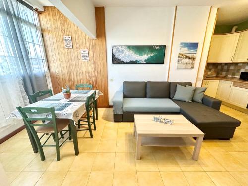 a living room with a couch and a table at Lima Limon by Lovely property in Cotillo