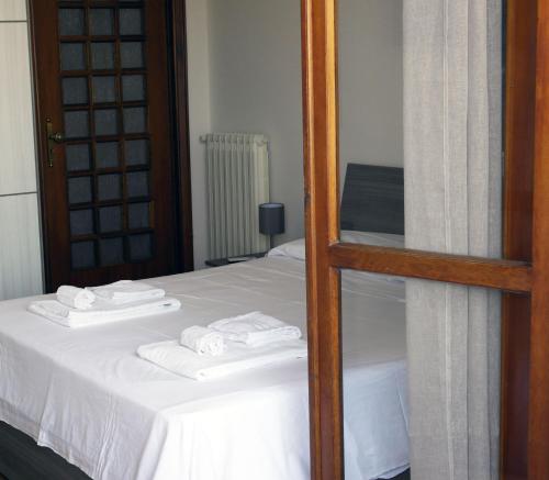 Ένα ή περισσότερα κρεβάτια σε δωμάτιο στο Ribo Apartments